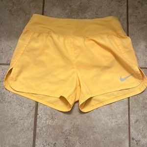 Yellow Nike training shorts